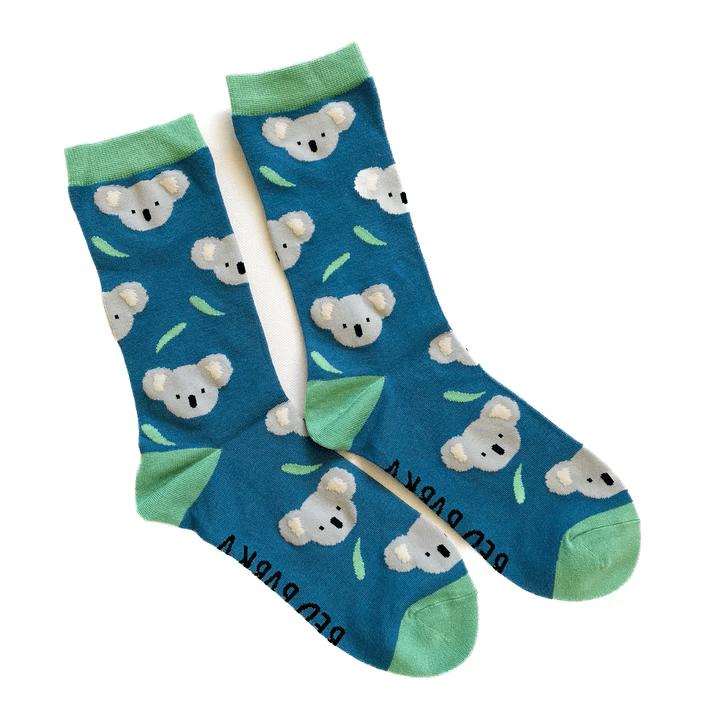 Pair of blue socks with koala face design on a white background